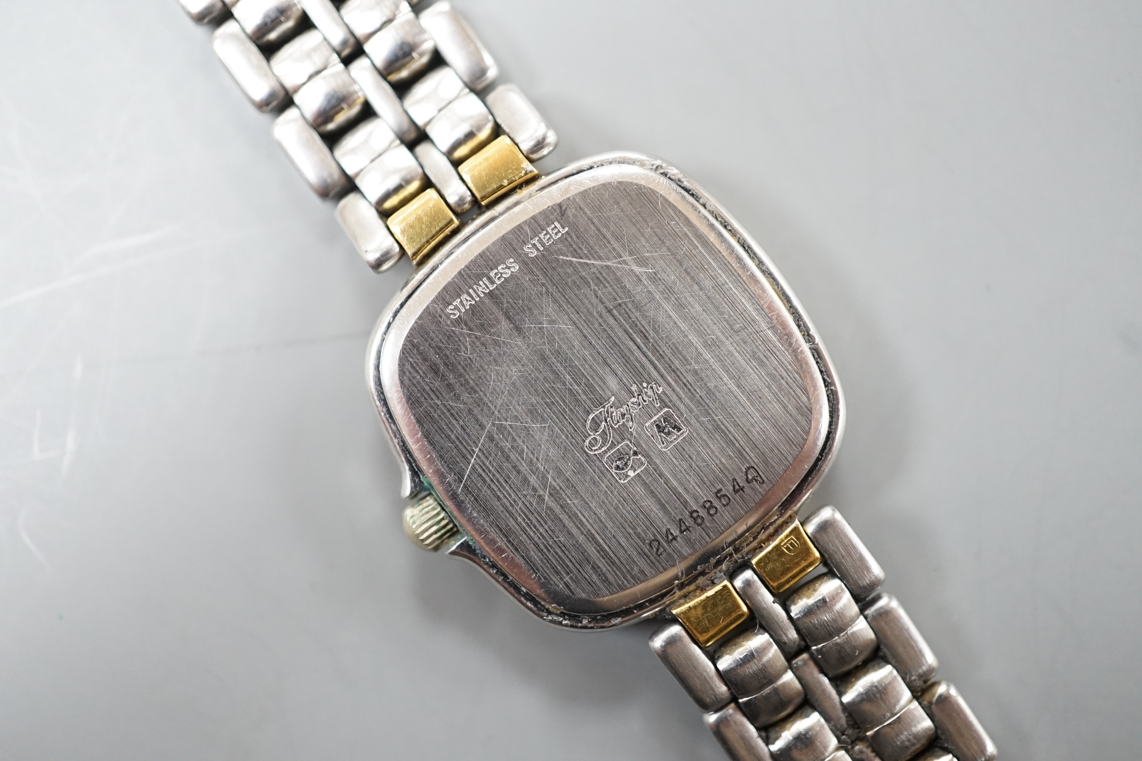 A lady's modern steel and gold plated Longines quartz wrist watch, on a steel and gold plated Longines bracelet.
